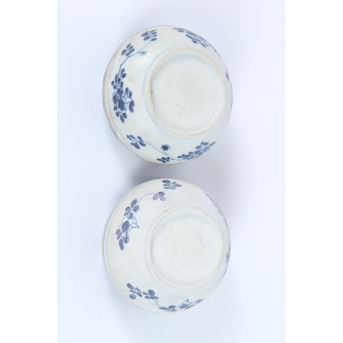 206 - TWO HATCHER CARGO BLUE AND WHITE POTS AND COVERS, decorated with flowers. 9cms diameter.