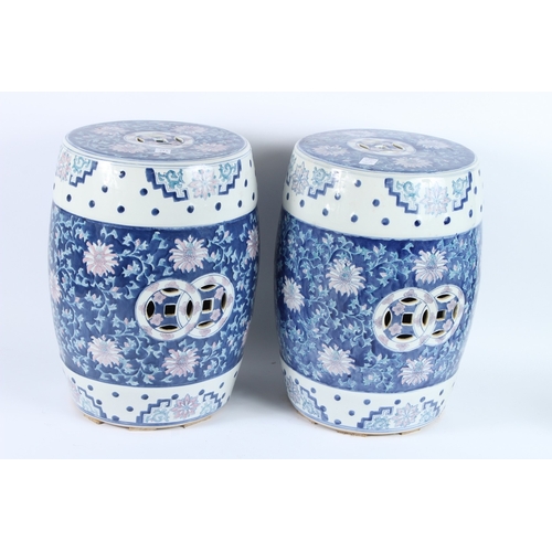 212 - A PAIR OF CHINESE BLUE AND WHITE BARREL SEATS. 42cms high.