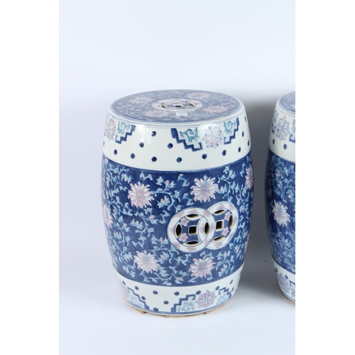 212 - A PAIR OF CHINESE BLUE AND WHITE BARREL SEATS. 42cms high.