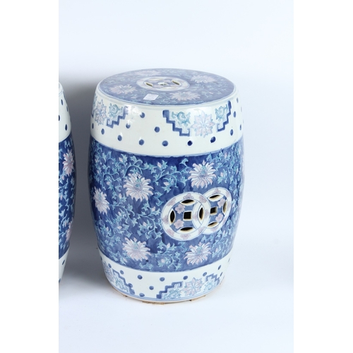212 - A PAIR OF CHINESE BLUE AND WHITE BARREL SEATS. 42cms high.