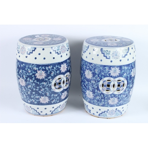 212 - A PAIR OF CHINESE BLUE AND WHITE BARREL SEATS. 42cms high.