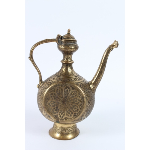 214 - A FINE 19TH CENTURY INDIAN ENGRAVED BRASS EWER. 27cms high.