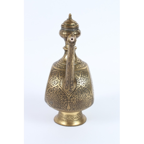 214 - A FINE 19TH CENTURY INDIAN ENGRAVED BRASS EWER. 27cms high.