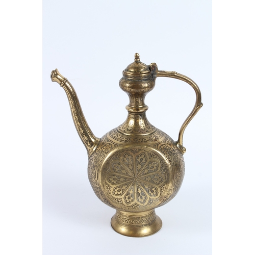 214 - A FINE 19TH CENTURY INDIAN ENGRAVED BRASS EWER. 27cms high.