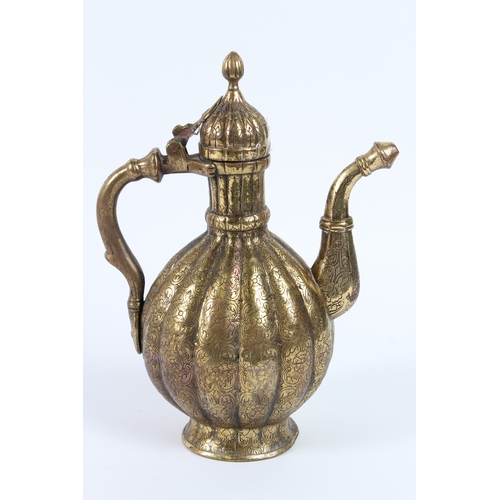 216 - A FINE 18TH - 19TH CENTURY MUGHAL INDIAN ENGRAVED BRASS EWER. 30cms high.