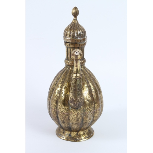 216 - A FINE 18TH - 19TH CENTURY MUGHAL INDIAN ENGRAVED BRASS EWER. 30cms high.