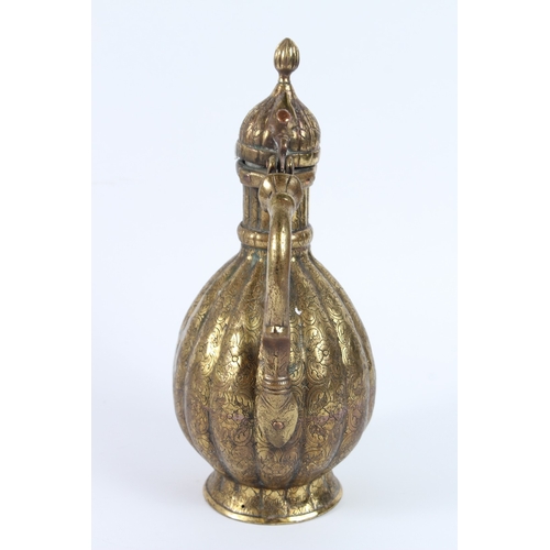 216 - A FINE 18TH - 19TH CENTURY MUGHAL INDIAN ENGRAVED BRASS EWER. 30cms high.