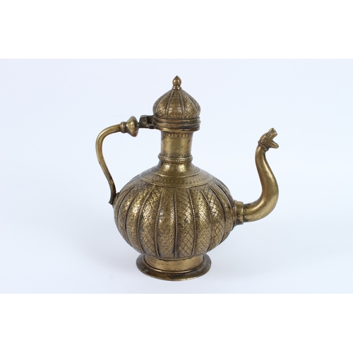 217 - AN 18TH - 19TH CENTURY MUGHAL INDIAN BRASSS OR BRONZE EWER. 26cms high.