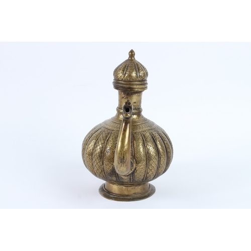217 - AN 18TH - 19TH CENTURY MUGHAL INDIAN BRASSS OR BRONZE EWER. 26cms high.