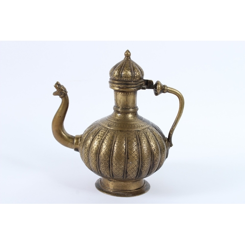 217 - AN 18TH - 19TH CENTURY MUGHAL INDIAN BRASSS OR BRONZE EWER. 26cms high.