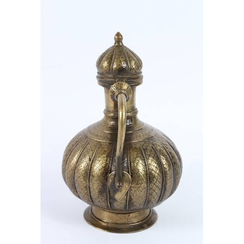217 - AN 18TH - 19TH CENTURY MUGHAL INDIAN BRASSS OR BRONZE EWER. 26cms high.