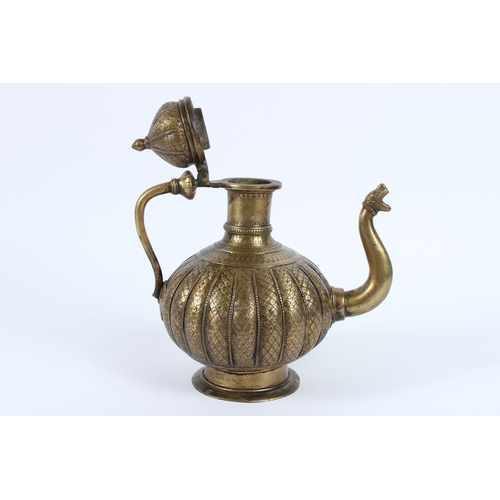 217 - AN 18TH - 19TH CENTURY MUGHAL INDIAN BRASSS OR BRONZE EWER. 26cms high.