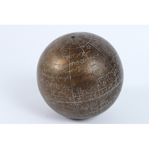220 - A 19TH - 20TH CENTURY INDIAN ENGRAVED BRASS CELESTIAL GLOBE. 14cms diameter.