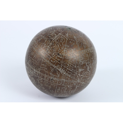 220 - A 19TH - 20TH CENTURY INDIAN ENGRAVED BRASS CELESTIAL GLOBE. 14cms diameter.