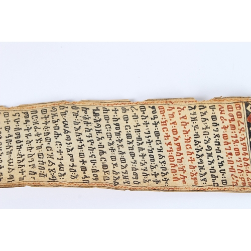 235 - A 19TH CENTURY ETHIOPIAN CALLIGRAPHIC SCROLL. 178cms high x 8cms wide.