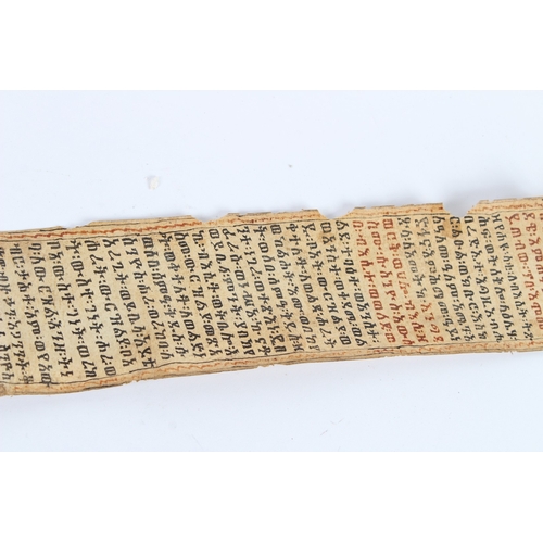 235 - A 19TH CENTURY ETHIOPIAN CALLIGRAPHIC SCROLL. 178cms high x 8cms wide.