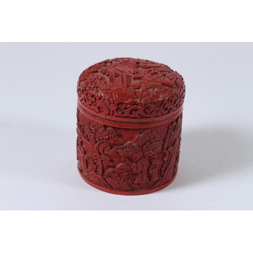 28 - A CHINESE CINNABAR LACQUER CIRCULAR BOX AND COVER. 9cms high.