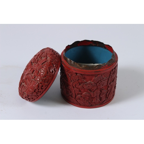 28 - A CHINESE CINNABAR LACQUER CIRCULAR BOX AND COVER. 9cms high.