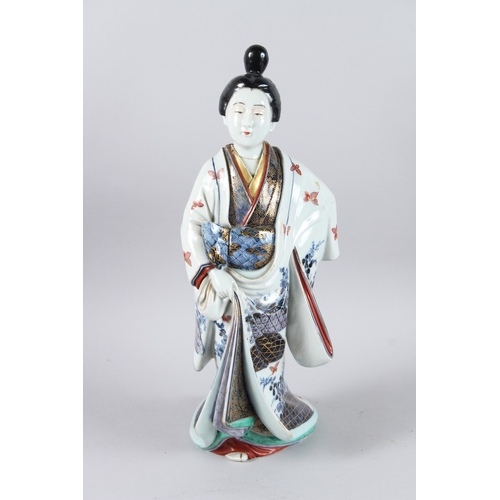 64 - A LARGE JAPANESE PORCELAIN GEISHA. 44cms high.