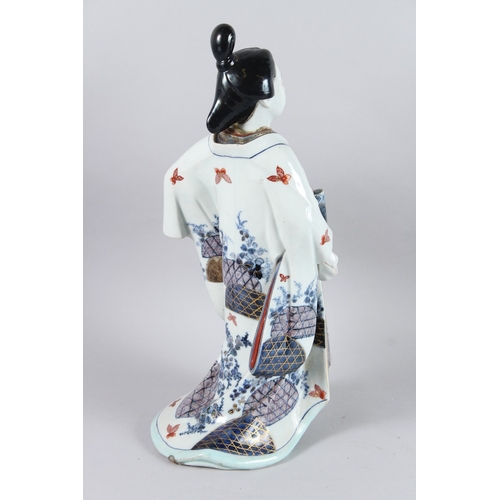 64 - A LARGE JAPANESE PORCELAIN GEISHA. 44cms high.