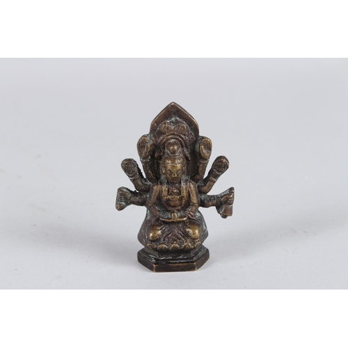 65 - A SMALL INDIAN BRONZE GOD FIGURE. 8cms high.