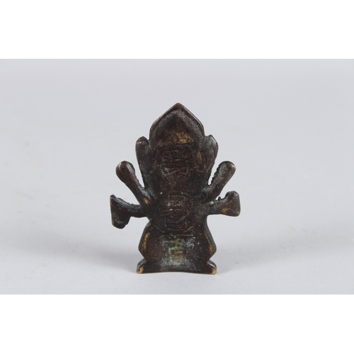 65 - A SMALL INDIAN BRONZE GOD FIGURE. 8cms high.