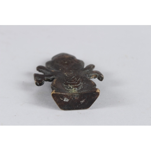 65 - A SMALL INDIAN BRONZE GOD FIGURE. 8cms high.