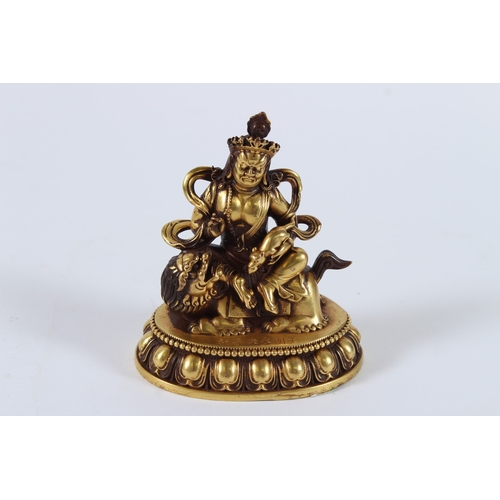 71 - A FINE GILT ALLOY TIBETAN PALDEN LHAMO. 8cms high.
