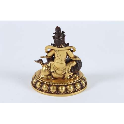 71 - A FINE GILT ALLOY TIBETAN PALDEN LHAMO. 8cms high.