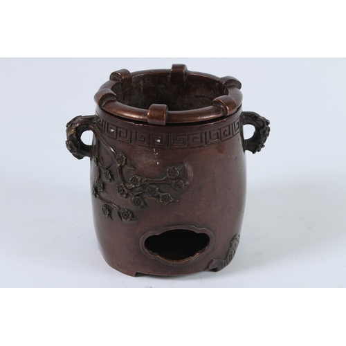 72 - A CHINESE BRONZE INCENSE BURNER. 12cms high.