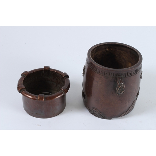 72 - A CHINESE BRONZE INCENSE BURNER. 12cms high.