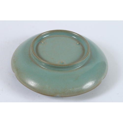 76 - A CHINESE RU WARE TEACUP TRAY. 17cms diameter.