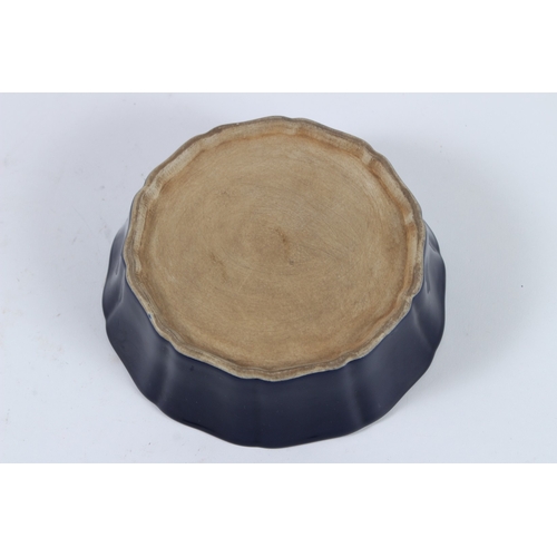 77 - A SACRIFICE BLUE GROUND GLAZE WHITE PHOENIX BOWL. 17cms diameter.