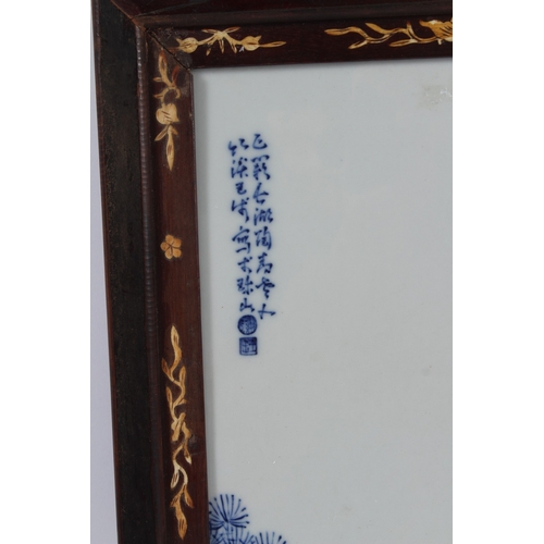 79 - A FINE CHINESE BLUE AND WHITE PLAQUE with bone mount frame. 34cms x 21cms.