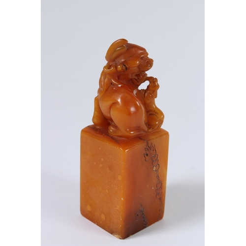 84 - A CHINESE SOAPSTONE SEAL. 12cms high.