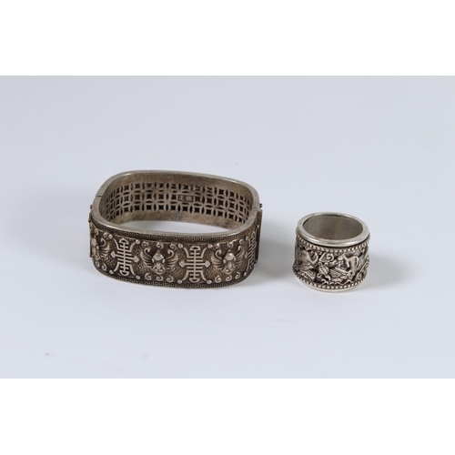 85 - A CHINESE WHITE METAL RING AND BRACELET.