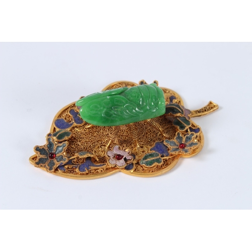 90 - A JADEITE CICADA MOUNTED GILT METAL LEAF. 11cms.