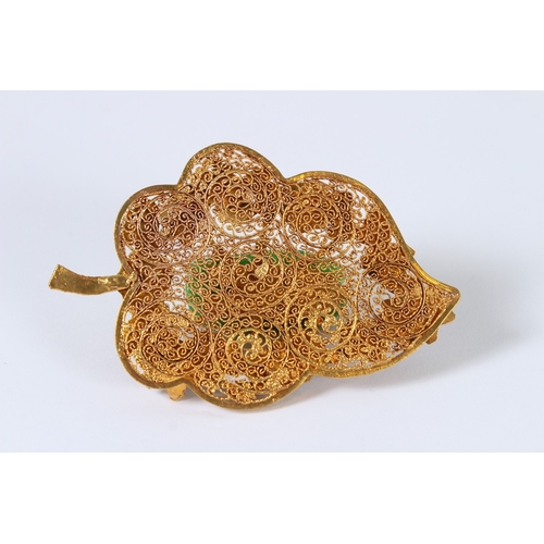 90 - A JADEITE CICADA MOUNTED GILT METAL LEAF. 11cms.