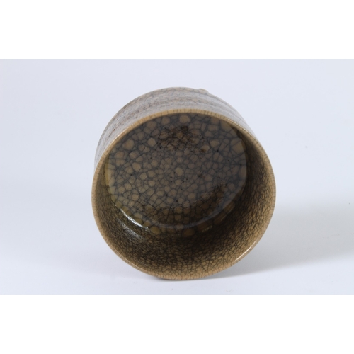 91 - A CHINESE CRACKLE GLAZED TRIPOD BURNER. 11cms diameter.