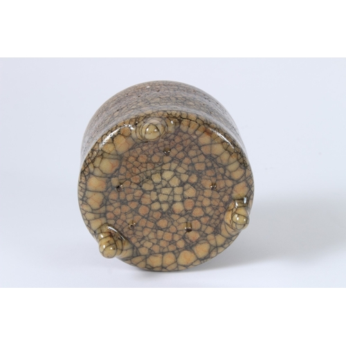 91 - A CHINESE CRACKLE GLAZED TRIPOD BURNER. 11cms diameter.