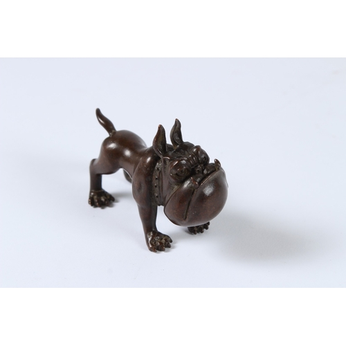 94 - A JAPANESE BRONZE DOG. 8cms.