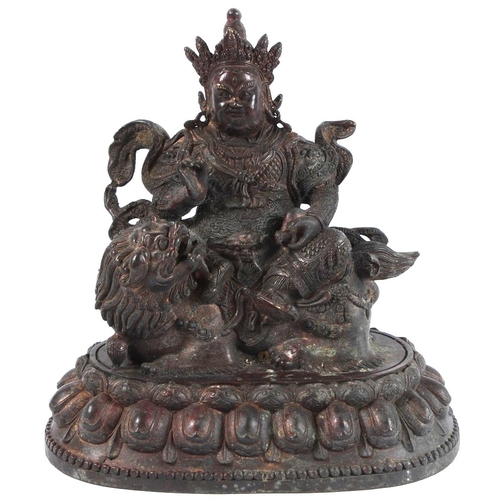 82 - A GILT BRONZE TIBETAN PALDEN LHAMO BUDDHA. 20cms high.