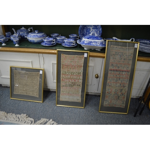 553 - Three 19th century framed and glazed alphabet samplers.