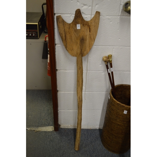 559 - A carved wood dance paddle, possibly Aboriginal.