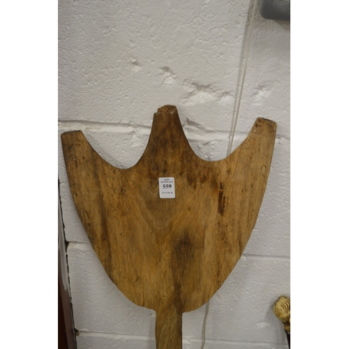 559 - A carved wood dance paddle, possibly Aboriginal.