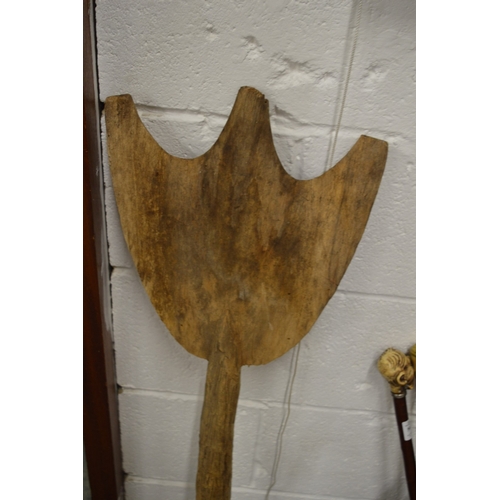 559 - A carved wood dance paddle, possibly Aboriginal.