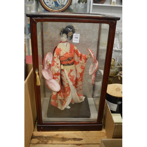 568 - Glass display case containing a model of a Geisha girl.