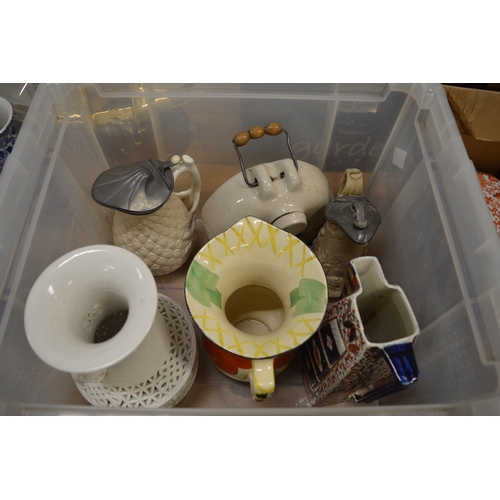 580 - A good collection of pottery jugs, porcelain and assorted china ornaments.