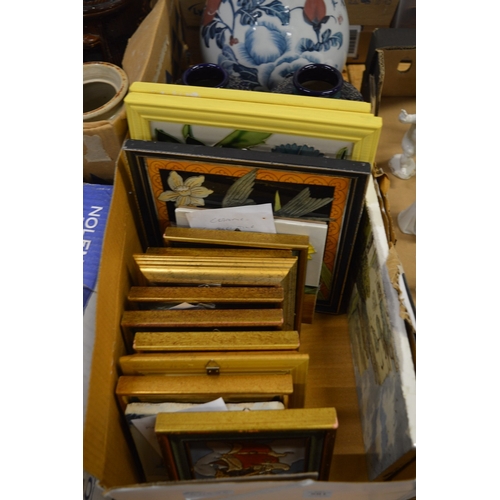 581 - A group of tile pictures, mostly framed and glazed.