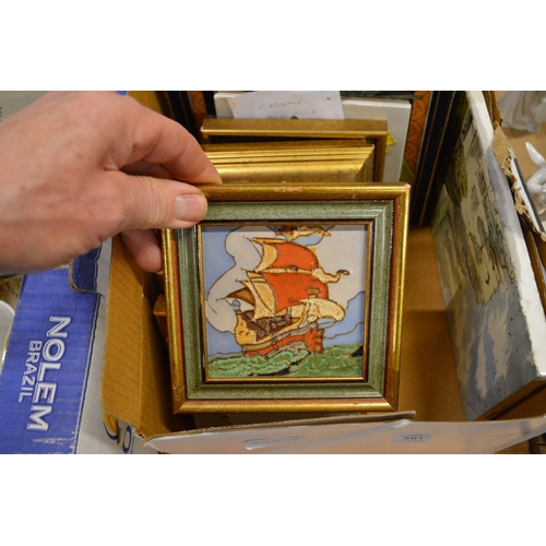 581 - A group of tile pictures, mostly framed and glazed.